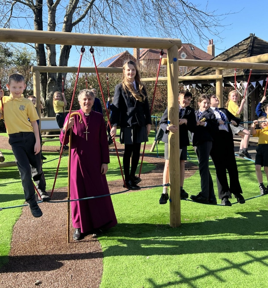 Bishop of Worcester with pupils on the new play area
